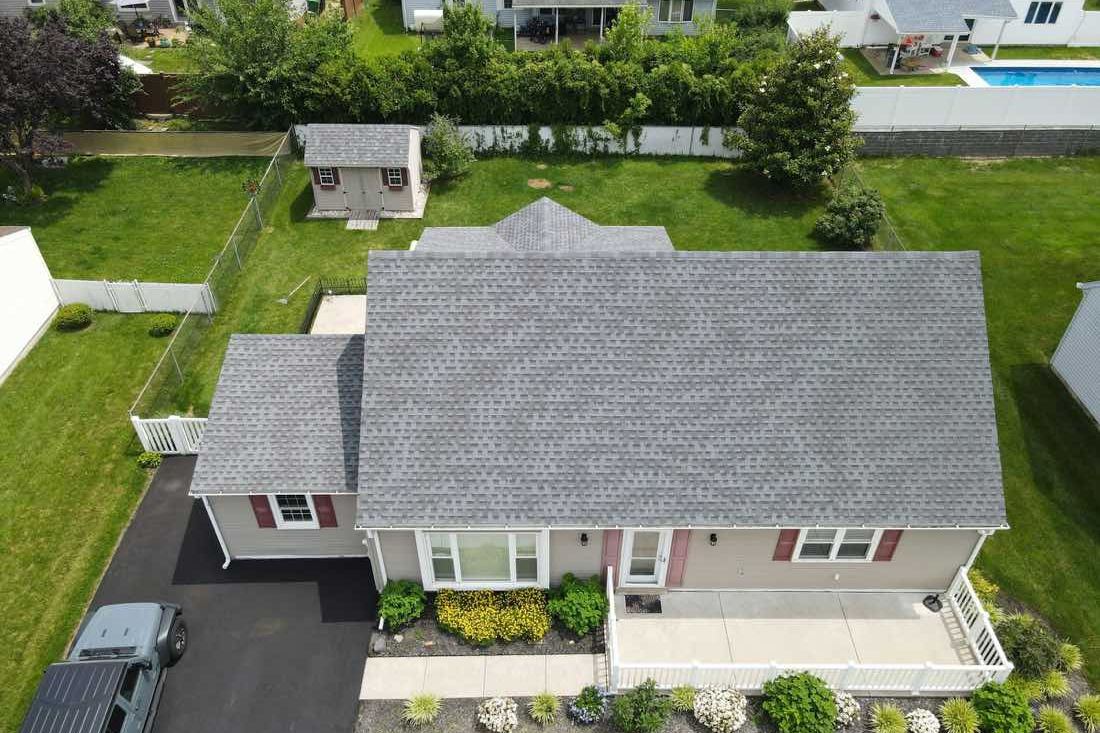 Aerial view of a full roof replacement on a single-family home